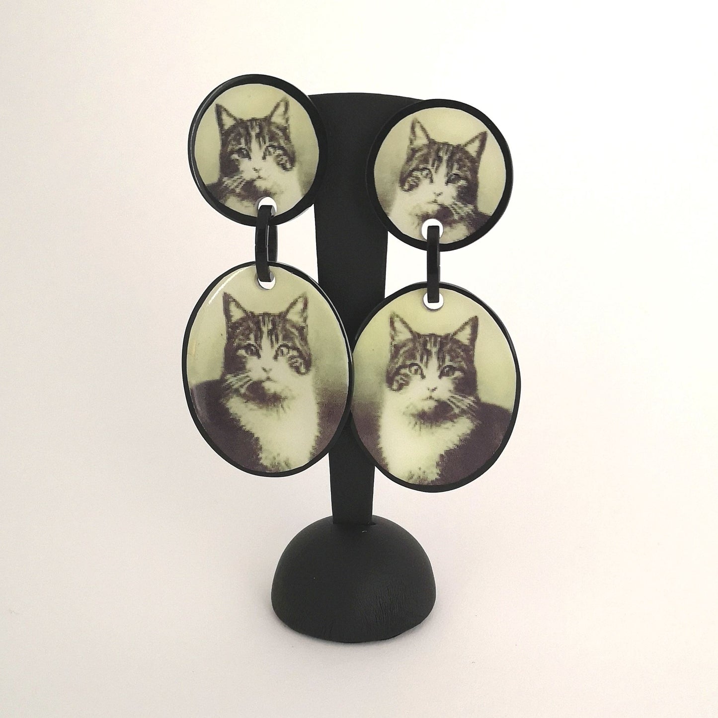 Pair of vintage resin earrings by designer Marion Godard with 2 old pictures of tiger cats