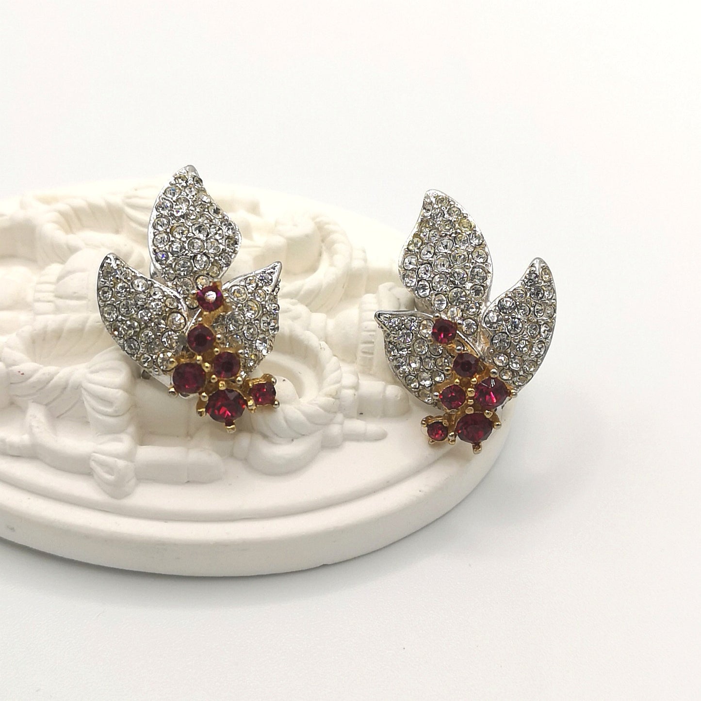 Vintage leaf motif earrings with white and red rhinestones in white metal - 1960 by Boucher